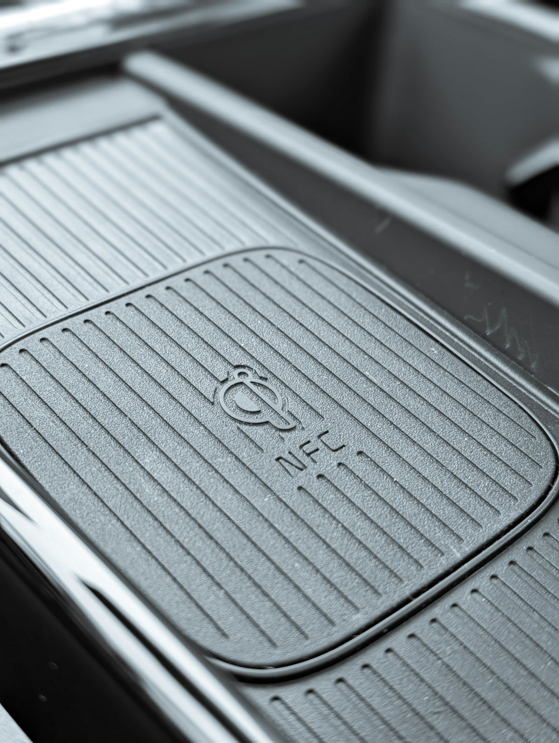 Close-up of a car's wireless charging pad.